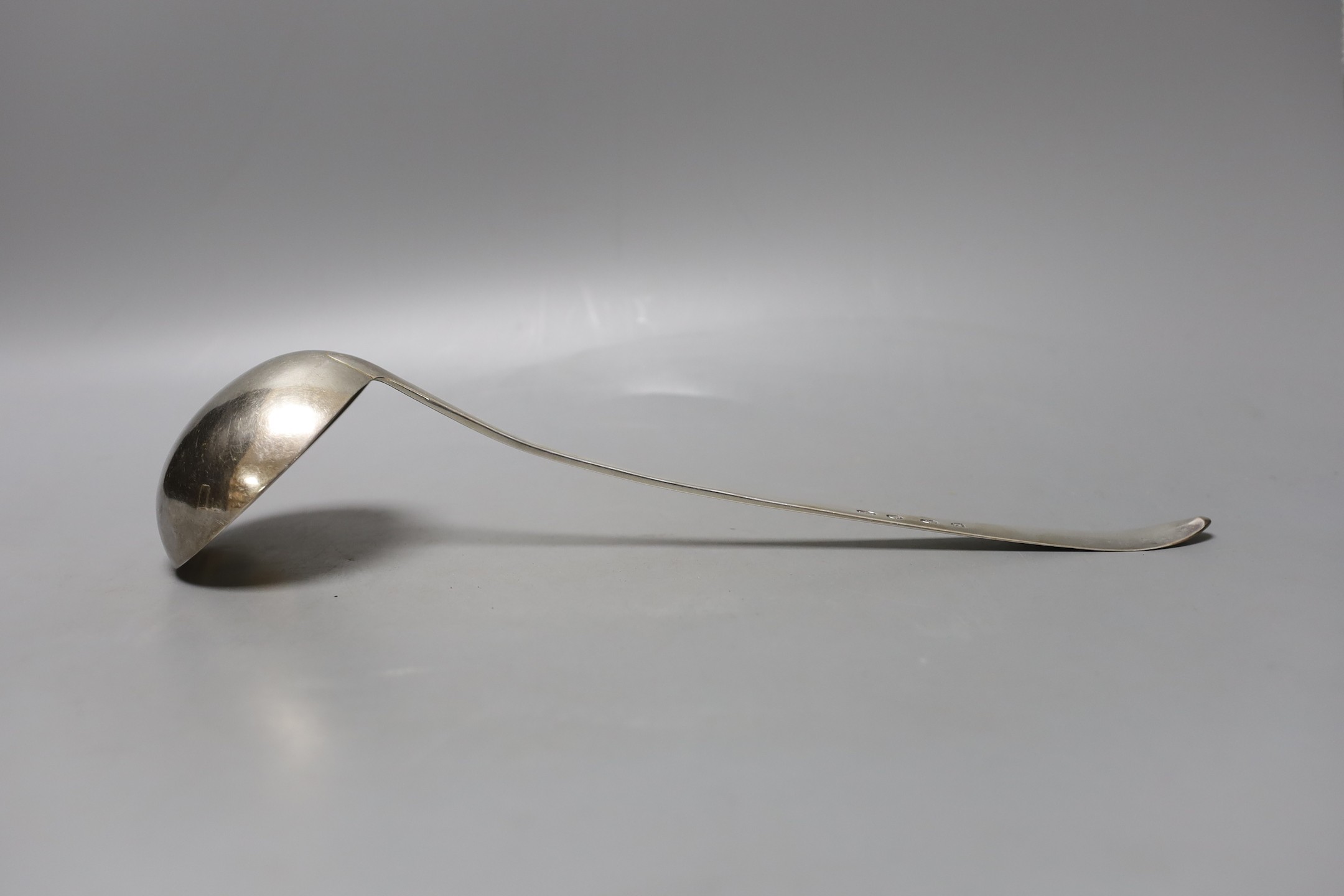 A George III Irish silver bright cut engraved soup ladle, Law & Bayly, Dublin, 1794, 37cm, 191 grams.